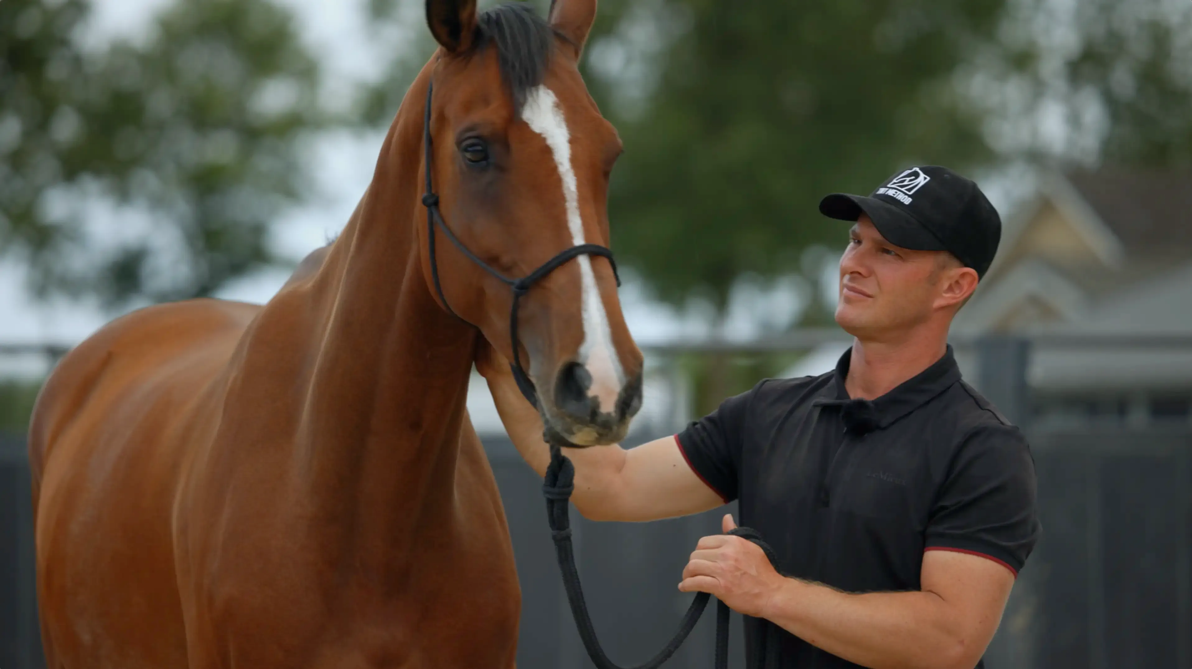 Still image from Camp TRT showing Tristan Tucker and a horse.